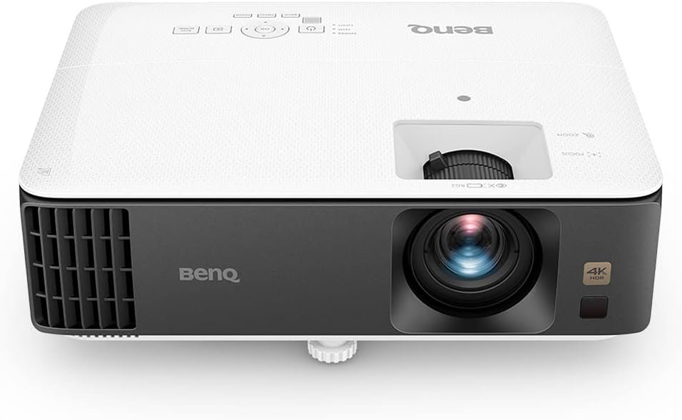 A family watches a movie projected by the BenQ TK700 on a 100-inch screen in a cozy living room, with popcorn bowls and a soundbar enhancing the experience.