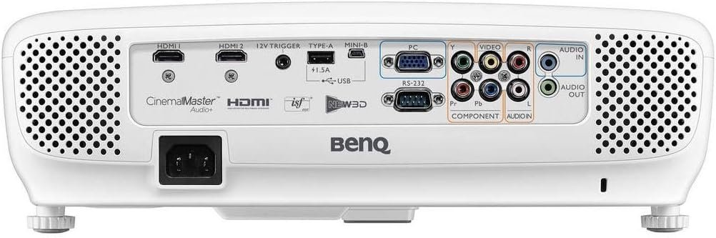 BenQ HT2050A remote control in hand, adjusting settings in a dark home theater room.