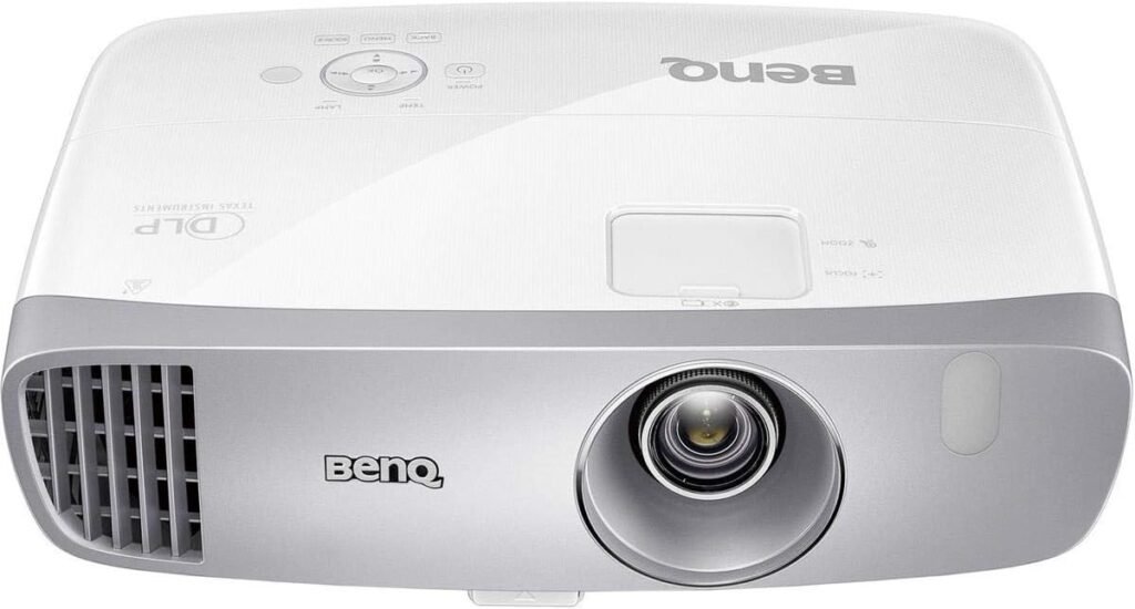 Gamer playing a fast-paced video game projected by the BenQ HT2050A on a large screen.