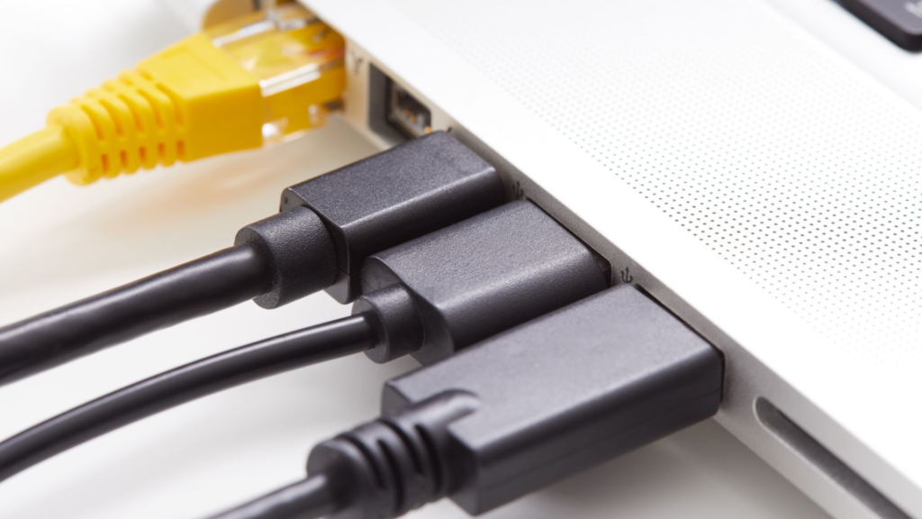 Benefits of network switches for home and business PoE configuration showing wireless access points IP cameras and VoIP phones powered and connected through single ethernet cable from PoE switch