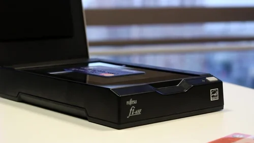 Compact Fujitsu fi-65F flatbed scanner in action

